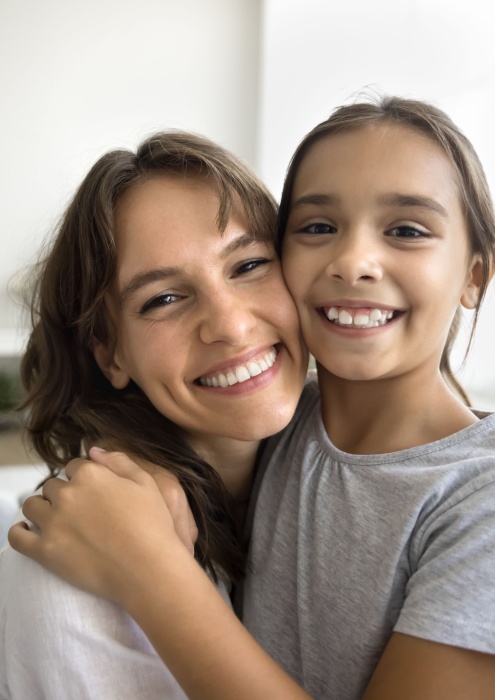 mother and daughter smiling