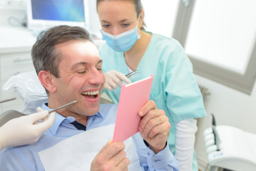 patient looking at his new smile